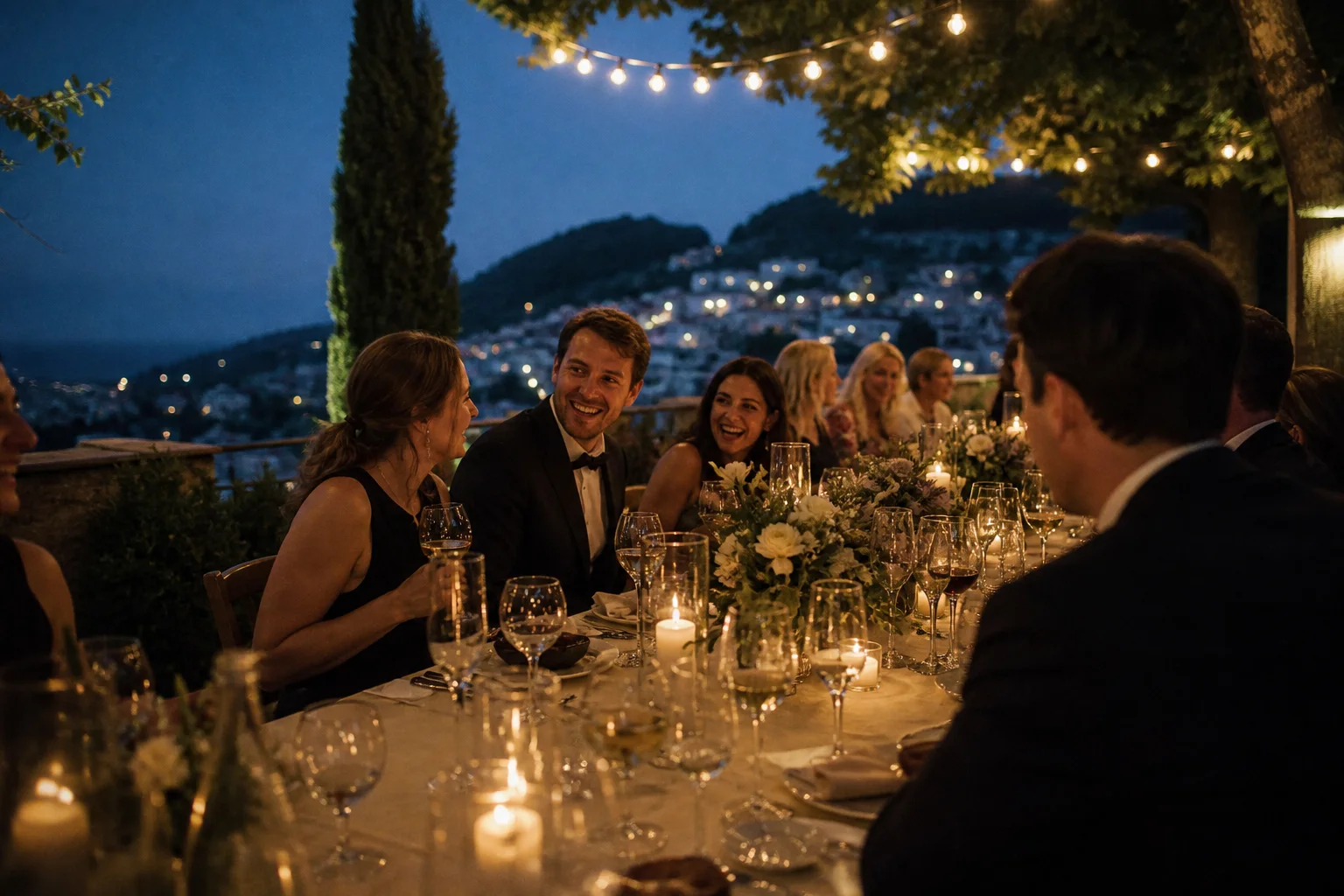 Wedding guests gathered for a candlelit dinner